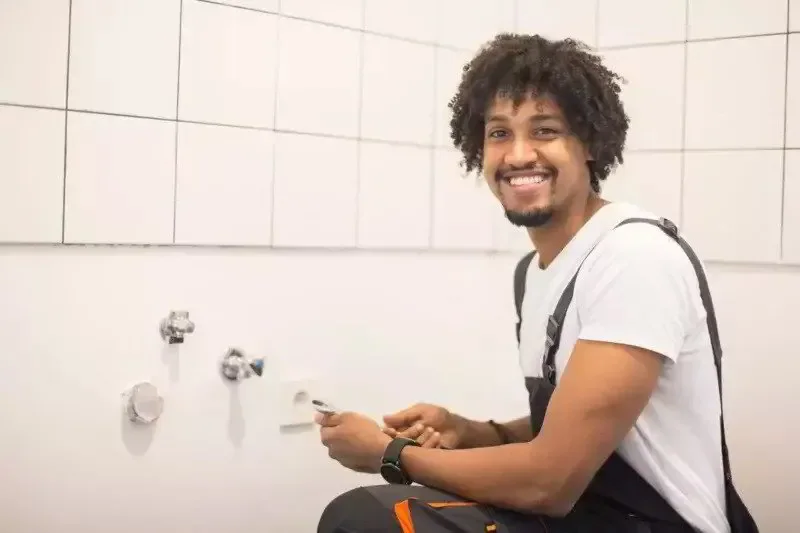 happy plumber