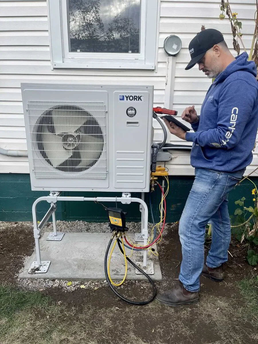 HVAC tech checking refrigerant levels