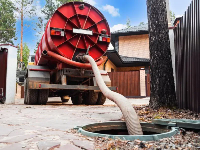 Truck pumping out a septic tank