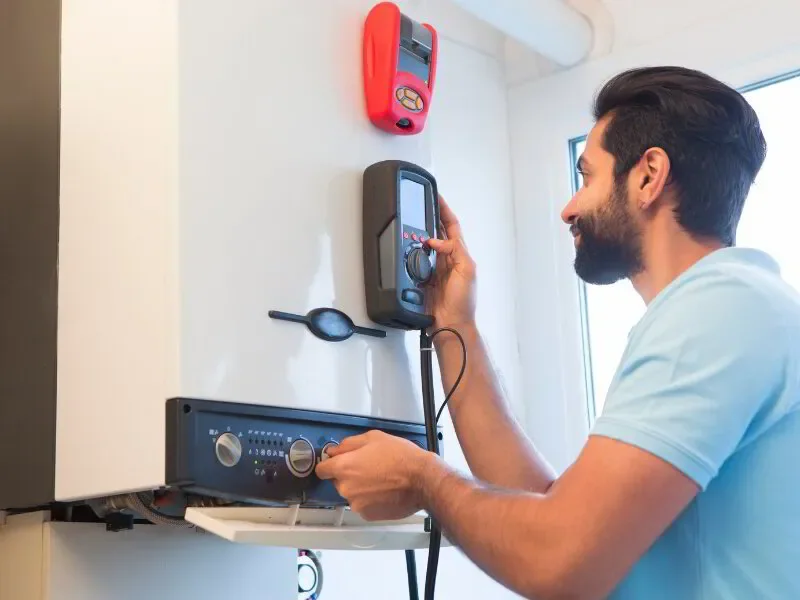 HVAC engineer working on a central heating boiler