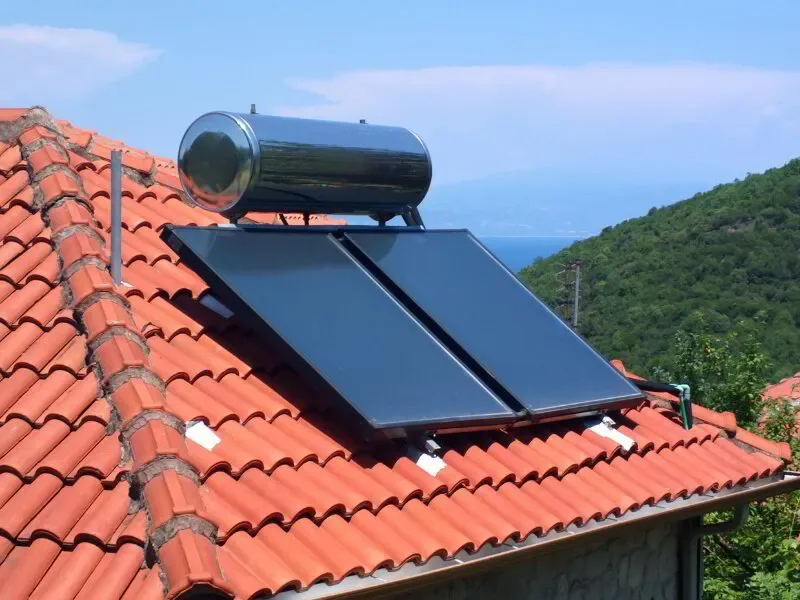 solar heater mounted to a rooftop on a sunny day