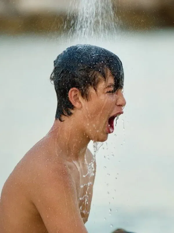 kid having a cold shower