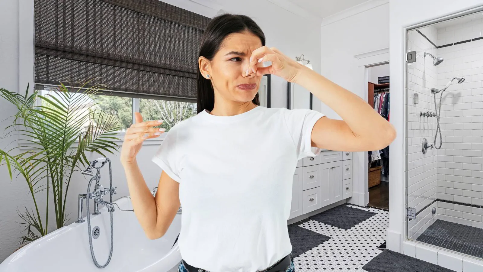 Woman holding her nose in a smelly bathroom